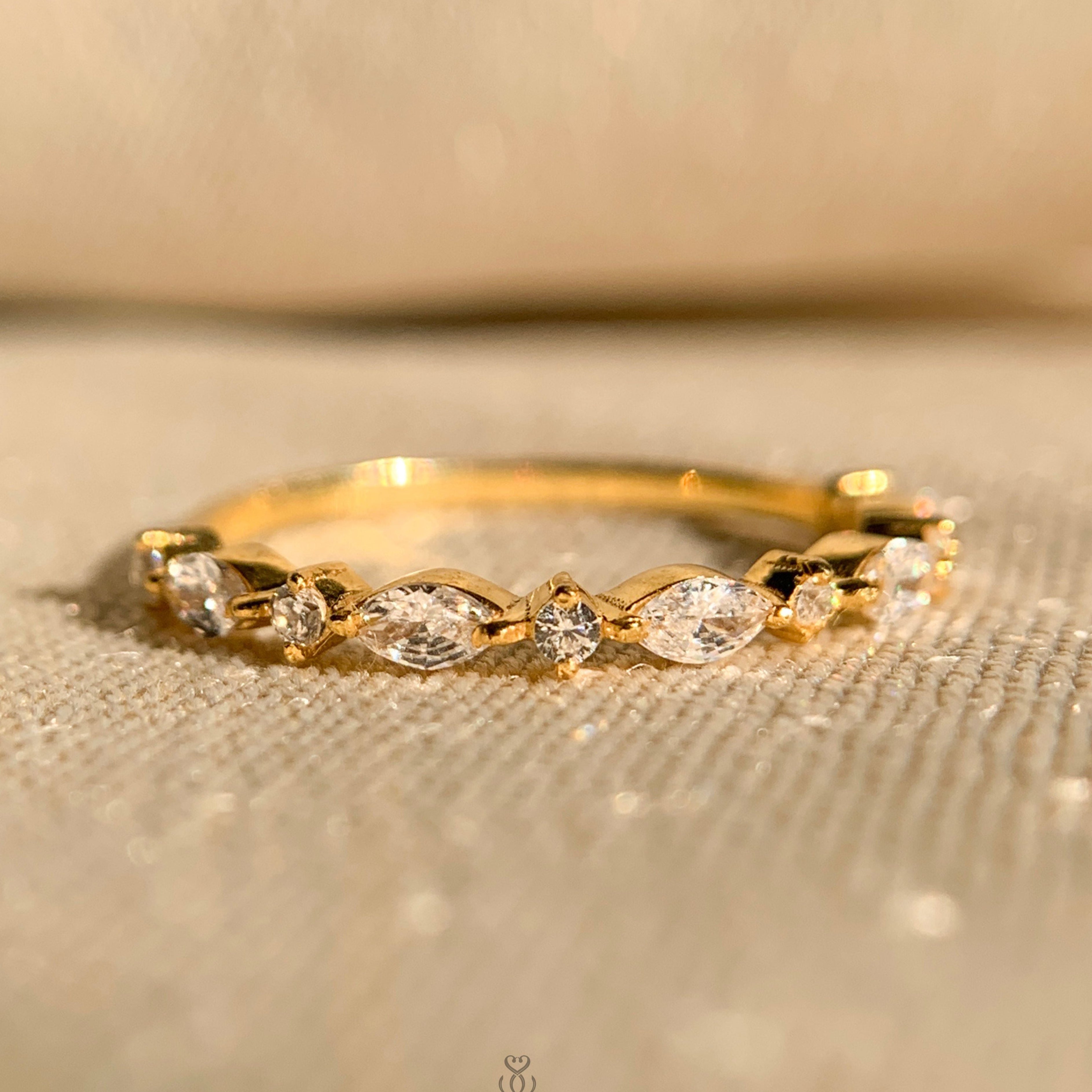 Marquise and round shape half eternity diamond ring in white gold